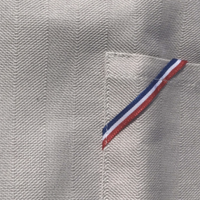 tablier beige, ici détail de la poche ventrale - tissé et fabriqué en France